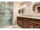 Bathroom showcasing dual sinks with granite counters and a glass-enclosed shower at 3379 E San Pedro Ave, Gilbert, AZ 85234