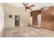 Spacious primary bedroom featuring neutral carpets, high ceilings, and a ceiling fan at 3379 E San Pedro Ave, Gilbert, AZ 85234