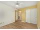 Bedroom with vinyl floors, neutral wall colors, a ceiling fan and bathroom access at 3379 E San Pedro Ave, Gilbert, AZ 85234