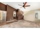 The large primary bedroom has neutral walls, carpet and direct bath access at 3379 E San Pedro Ave, Gilbert, AZ 85234