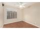 Bedroom featuring vinyl floors, neutral wall color, and a ceiling fan at 3379 E San Pedro Ave, Gilbert, AZ 85234