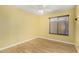 Bedroom with laminate floors, neutral wall color, and a ceiling fan at 3379 E San Pedro Ave, Gilbert, AZ 85234