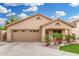 Single-story home featuring a large driveway, manicured front lawn, and inviting entrance at 3379 E San Pedro Ave, Gilbert, AZ 85234