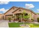 Inviting single-story home showcases a cozy front porch and well-maintained landscaping at 3379 E San Pedro Ave, Gilbert, AZ 85234