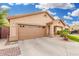 Single-story home featuring a large driveway, manicured front lawn, and inviting entrance at 3379 E San Pedro Ave, Gilbert, AZ 85234