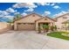 Single-story home featuring a large driveway, manicured front lawn, and inviting entrance at 3379 E San Pedro Ave, Gilbert, AZ 85234