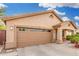Single-story home featuring a large driveway, manicured front lawn, and inviting entrance at 3379 E San Pedro Ave, Gilbert, AZ 85234