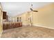 Open-concept kitchen with granite countertops, tile floors, and dark wood cabinets at 3379 E San Pedro Ave, Gilbert, AZ 85234