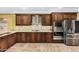 The bright kitchen features stainless steel appliances, custom cabinets, and granite countertops at 3379 E San Pedro Ave, Gilbert, AZ 85234