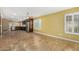 Spacious living room with tile floors open to the updated kitchen with stainless steel appliances at 3379 E San Pedro Ave, Gilbert, AZ 85234