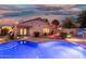 Backyard pool with a covered patio and a desert landscaped backyard at 3379 E San Pedro Ave, Gilbert, AZ 85234