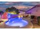 Inviting backyard pool with desert landscaping and privacy wall at 3379 E San Pedro Ave, Gilbert, AZ 85234