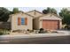 Charming single-story home with a two-car garage and desert landscaping, featuring tan stucco and a red tile roof at 355 S Calle Miguel --, Casa Grande, AZ 85194