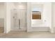 Bathroom with a separate shower and tub, as well as wood-look flooring at 361 S Calle Miguel --, Casa Grande, AZ 85194