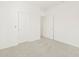 Bright bedroom with neutral walls, carpet, and white doors, providing a blank canvas at 361 S Calle Miguel --, Casa Grande, AZ 85194