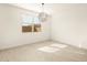 Bedroom with tile flooring, natural light, and modern light fixture at 361 S Calle Miguel --, Casa Grande, AZ 85194