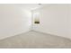 Bright bedroom featuring neutral carpet and a window with blinds at 361 S Calle Miguel --, Casa Grande, AZ 85194
