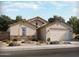 Charming single-story home featuring desert landscaping, stone accents, and a two-car garage at 361 S Calle Miguel --, Casa Grande, AZ 85194