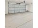 Spacious garage with a large garage door, offering ample parking and storage space at 361 S Calle Miguel --, Casa Grande, AZ 85194