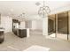 Open-concept kitchen with granite counters, pendant lights, and stainless steel appliances at 361 S Calle Miguel --, Casa Grande, AZ 85194
