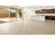 Spacious kitchen with tile floors, an island, and sliding glass doors at 361 S Calle Miguel --, Casa Grande, AZ 85194
