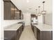 Modern kitchen with stainless appliances, granite countertops, and elegant pendant lighting at 361 S Calle Miguel --, Casa Grande, AZ 85194