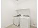 Clean laundry room with a modern washer and dryer and a shelf above at 361 S Calle Miguel --, Casa Grande, AZ 85194
