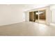 Bright living room with tile flooring and sliding doors to the backyard at 361 S Calle Miguel --, Casa Grande, AZ 85194