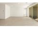 Spacious living room with tile flooring and recessed lighting, plus a sliding glass door at 361 S Calle Miguel --, Casa Grande, AZ 85194
