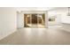 Bright living room featuring tile flooring and a sliding glass door at 361 S Calle Miguel --, Casa Grande, AZ 85194