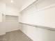 Walk-in closet view with carpet flooring and several shelves for storage at 361 S Calle Miguel --, Casa Grande, AZ 85194