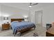 Bedroom with wood floors, ceiling fan, and ensuite bathroom at 37103 N El Morro Trl, San Tan Valley, AZ 85140