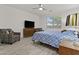 Bedroom with wood floors, ceiling fan, and lots of natural light at 37103 N El Morro Trl, San Tan Valley, AZ 85140
