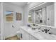 Modern bathroom featuring a double vanity, stylish fixtures, and an illuminated mirror at 3904 S Butte Ave, Tempe, AZ 85282
