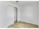 Bright bedroom with light wood floors and closet with sliding doors at 3904 S Butte Ave, Tempe, AZ 85282