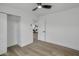 A bright bedroom features light wood floors, closet with sliding doors, and view to living area at 3904 S Butte Ave, Tempe, AZ 85282