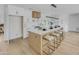 Gourmet kitchen features an oversized island with seating, stylish backsplash, and modern appliances at 3904 S Butte Ave, Tempe, AZ 85282