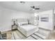 Bright main bedroom featuring a ceiling fan, stylish decor, and an ensuite bathroom at 3904 S Butte Ave, Tempe, AZ 85282