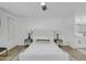 Bright main bedroom featuring stylish furnishings, a ceiling fan, and an ensuite bathroom at 3904 S Butte Ave, Tempe, AZ 85282