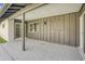 Covered patio with sliding glass doors, textured concrete, and brown painted wood trim at 3904 S Butte Ave, Tempe, AZ 85282
