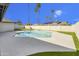 Sparkling backyard pool with artificial turf, palm trees and blue sky at 3904 S Butte Ave, Tempe, AZ 85282