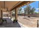 View of backyard with partial patio cover, decorative rock, and fire pit at 396 S 166Th Dr, Goodyear, AZ 85338