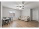 Relaxing bedroom with desk, couch, ceiling fan, and natural light from a window at 396 S 166Th Dr, Goodyear, AZ 85338