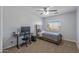 Well-lit bedroom furnished with a bed and a desk at 396 S 166Th Dr, Goodyear, AZ 85338
