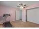 Bedroom featuring a treadmill and closet space at 396 S 166Th Dr, Goodyear, AZ 85338