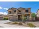 Charming two-story home with landscaped front yard and two-car garage at 396 S 166Th Dr, Goodyear, AZ 85338