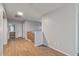 Upstairs hallway with wood floors and access to other areas of the home at 396 S 166Th Dr, Goodyear, AZ 85338