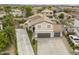 Aerial view of a two-story home with desert landscaping, extended drive, and large backyard at 40161 N Westray Way, San Tan Valley, AZ 85140