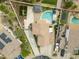 An aerial shot of a home showcasing the backyard oasis complete with pool, gazebo, and playground at 40161 N Westray Way, San Tan Valley, AZ 85140