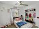 Charming bedroom with a ceiling fan, window, closet, and soft accents for cozy appeal at 40161 N Westray Way, San Tan Valley, AZ 85140